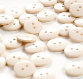 Knoflík plastový kulatý smetanový 24"