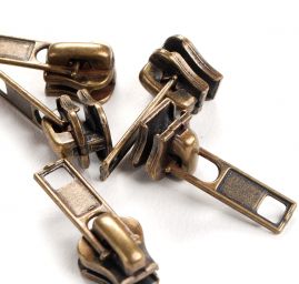 Jezdec ke kostěným zipům T5 s aretací staromosaz