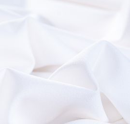 Kostýmová krepová látka vo farbe slonvé kosti