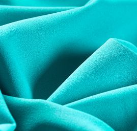 Kostýmová krepová látka tyrkysová