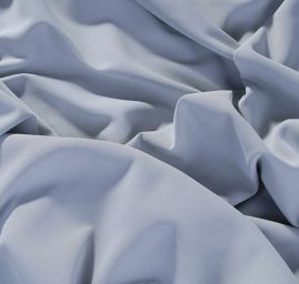 Pružná kostýmová látka pastelové sv. modré barvy