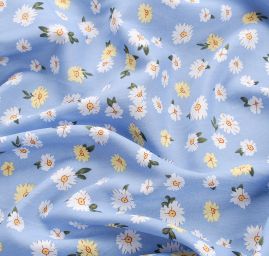 Viskozová šatová látka květy žlutobílé na modré