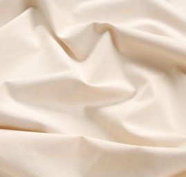 Bavlněná pružná látka smetanová