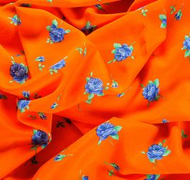 Viskózová látka vzor květy oranžová