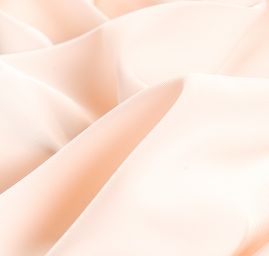 Kostýmová letní látka pastel meruňková