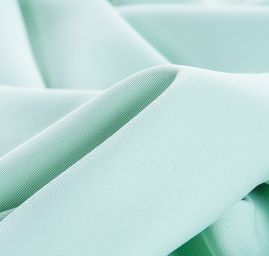 Kostýmová letní látka pastel sv. zelená