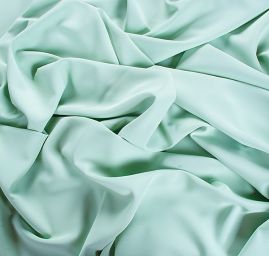 Kostýmová letní látka pastel sv. zelená