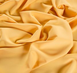 Kostýmová letní látka pastel žlutá