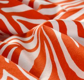 Viskozová látka zvířecí motiv zebra červená/smetana