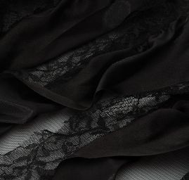 Tyl doplněn krajkou a volánky černý