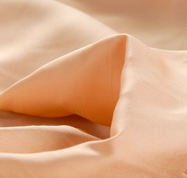 Cupro šatová látka tělové barvy