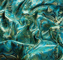 Efektní brokát hlavicový vzor zlatotyrkysový