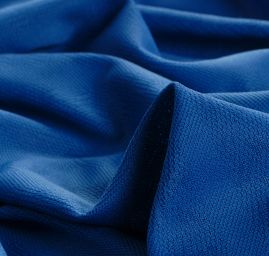 Pletenina s plastickým vzorem vlnek v pruzích modrá II.jakost