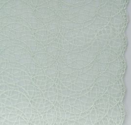 Krajka geometrický vzor vlnek pistáciová