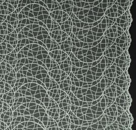 Krajka geometrický vzor vlnek pistáciová