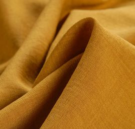 Kostýmová pružná látka imitace lnu okrová