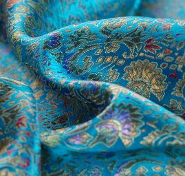 Látka brokát zlatý orientální motiv na tyrkysovém podkladu