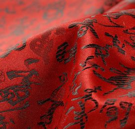 Látka brokát orientální motiv červená