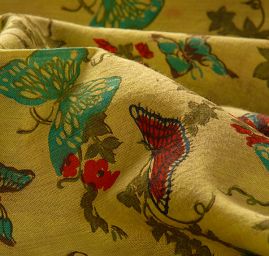 Bavlněná látka vzor batika/motýlci zelená