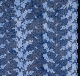 Efektní krajka květy na tylu s velkými oky v barvě modré