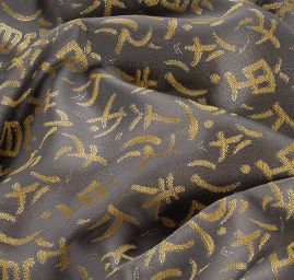 Brokát lamé motiv písma hnědožlutostříbrný