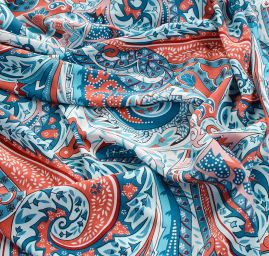 Viskozová šatová látka tisk paisley vzor cihlovomodrý
