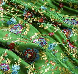 Brokát s folklórním motivem květů zelený