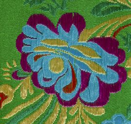 Brokát s folklórním motivem květů zelený