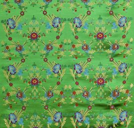 Brokát s folklórním motivem květů zelený