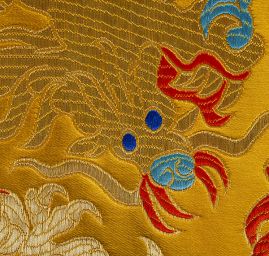 Brokát orientální motiv draka okrový