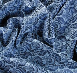 Žakárová látka se vzorem ornamentu modrá