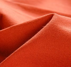 Bavlna směs pevnější pružná látka skořicové barvy
