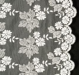 Krajka výšivka na tylu lístky/květy smetanová