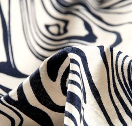 Bavlněná látka na šaty s abstraktním motivem