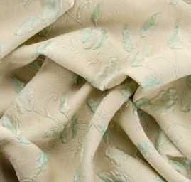 Žakárová látka se vzorem květů v pastel zelené