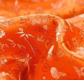 Brokát jemný květinový motiv oranžový