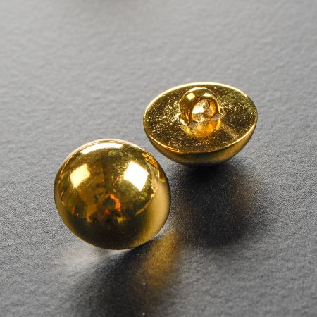 Knoflík půlkulatý zlatý s krčkem plast 28"