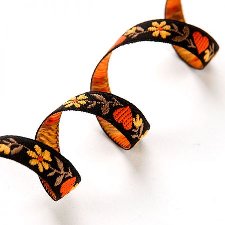 Stuha krojová vyšívaná černá 9mm žluté květy