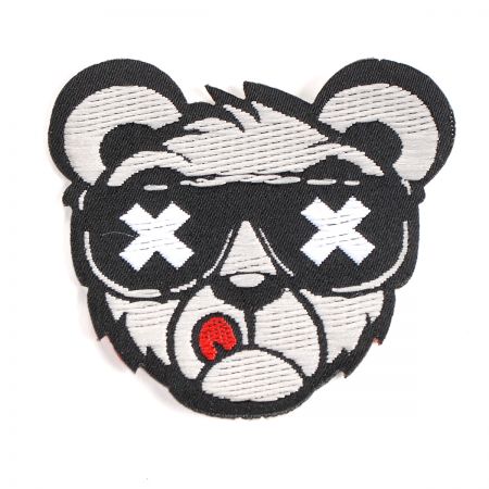 Nažehlovačka medvěd s brýlemi