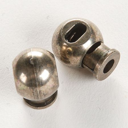 Brzdičky kulaté jednodírkové plast tm.stříbrná