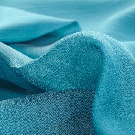 Šifon plise šanžán tmavě tyrkysová