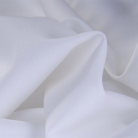 Letné kostýmová látka matná slonová kosť