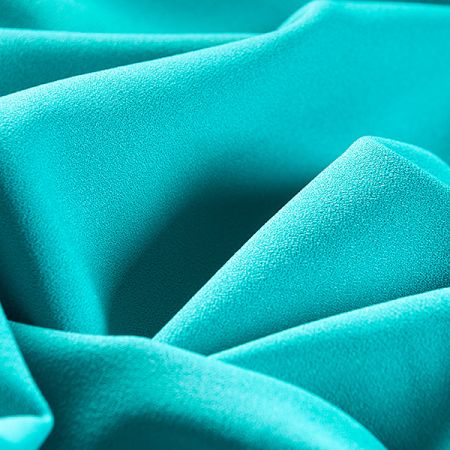 Kostýmová krepová látka tyrkysová