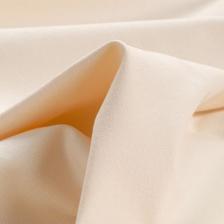 Bavlněná pružná látka smetanová