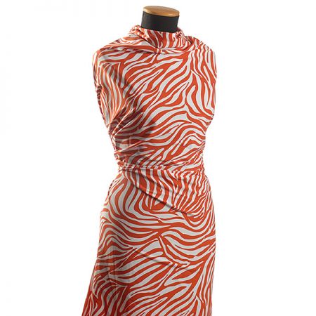 Viskozová látka zvířecí motiv zebra červená/smetana