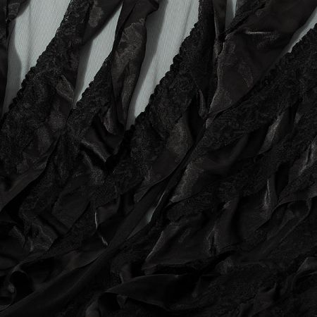 Tyl doplněn krajkou a volánky černý