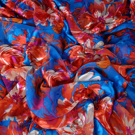 Hedvábný šifon květinový motiv oranžovomodrý