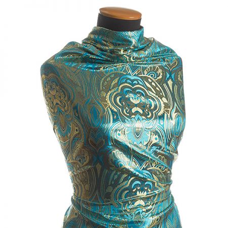 Efektní brokát hlavicový vzor zlatotyrkysový