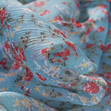 Šifon plise motiv drobné kytičky tyrkysový podklad