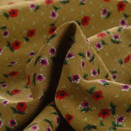 Viskozová šatová látka drobné květy zelená